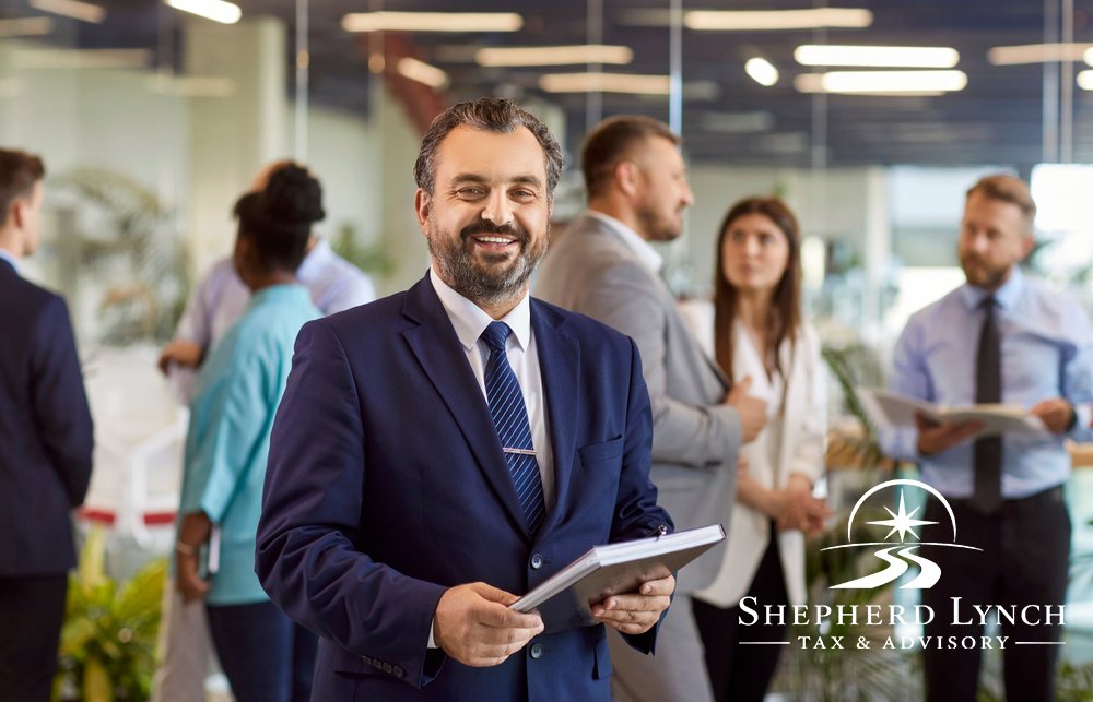Professional advisor holding documents in an office